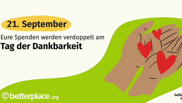 Bildbeschreibung: Zwei offene Hände halten rote Herzen. Text: "Eure Spenden werden verdoppelt am Tag der Dankbarkeit, 21. September." Das Bild symbolisiert Unterstützung und Dankbarkeit.