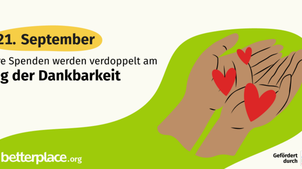 Bildbeschreibung: Zwei offene Hände halten rote Herzen. Text: "Eure Spenden werden verdoppelt am Tag der Dankbarkeit, 21. September." Das Bild symbolisiert Unterstützung und Dankbarkeit.